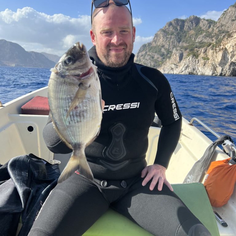 student on Spearfsihing course run in turkey learning to catch fish guilt head bream diving from boats Spearfishing foraging freediving holiday course Turkey